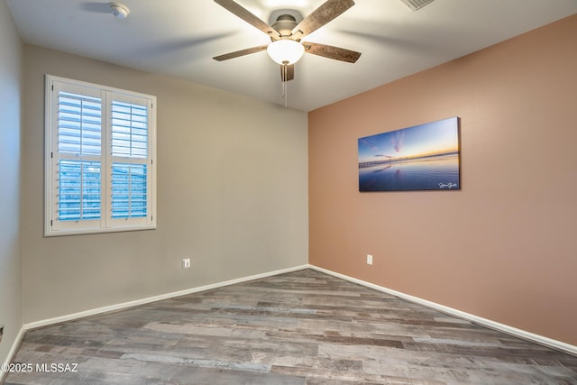 unfurnished room featuring ceiling fan and hardwood / wood-style floors