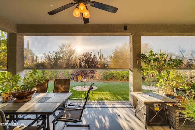 sunroom / solarium with ceiling fan