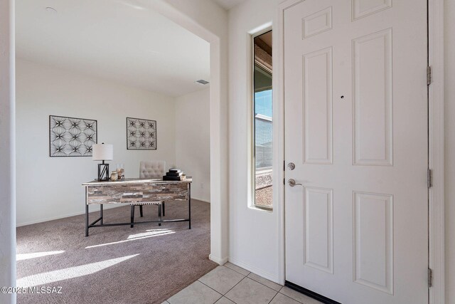 hallway with light carpet