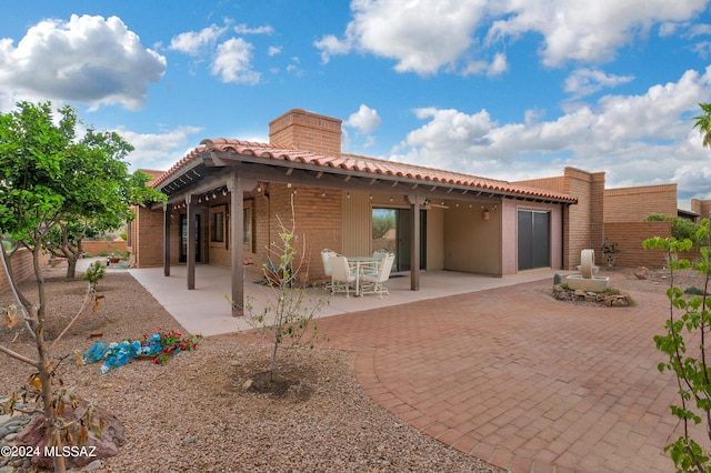 rear view of house with a patio