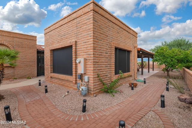 view of side of home featuring a patio