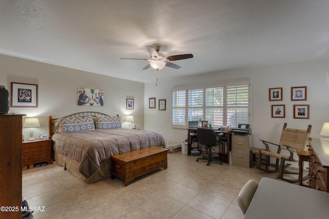 tiled bedroom featuring ceiling fan