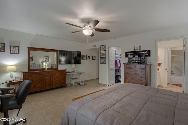 bedroom with ceiling fan, connected bathroom, a closet, and a spacious closet