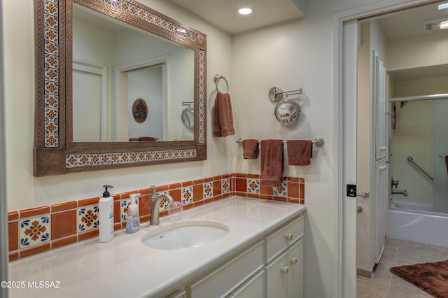 bathroom featuring vanity, combined bath / shower with glass door, and tile patterned floors