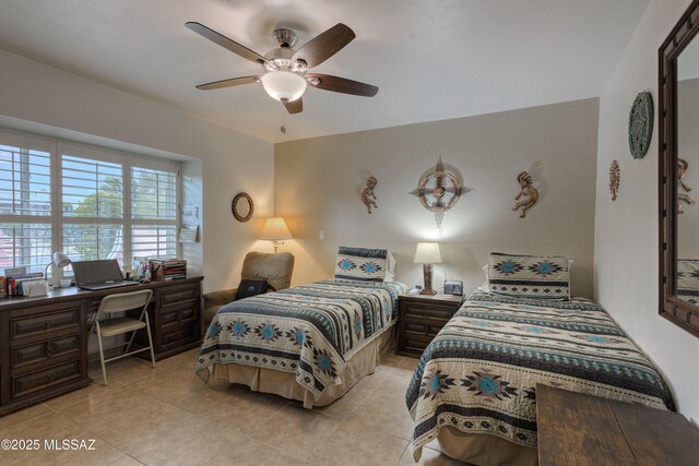 tiled bedroom with ceiling fan