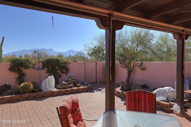 view of patio / terrace with a mountain view