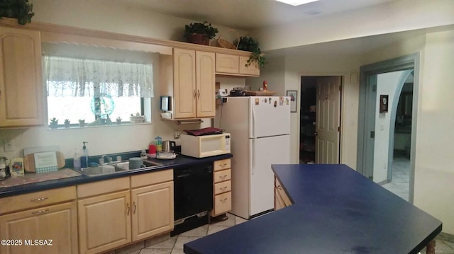 kitchen featuring arched walkways, white appliances, a sink, light brown cabinetry, and dark countertops