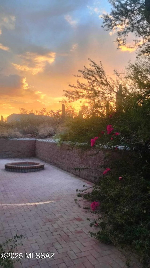 view of patio terrace at dusk