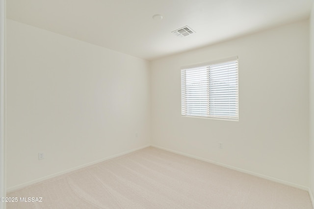 empty room with light colored carpet