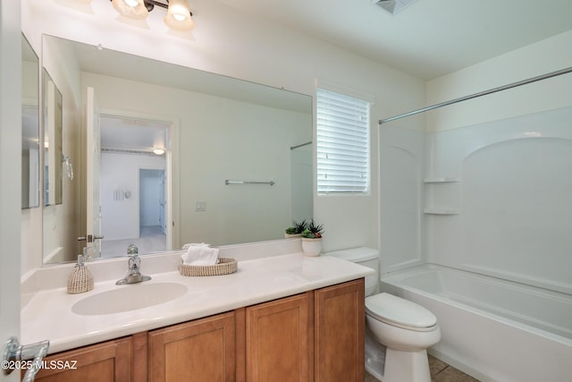 full bathroom with vanity, tub / shower combination, and toilet