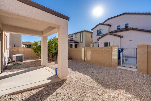 view of yard with a patio and central AC unit