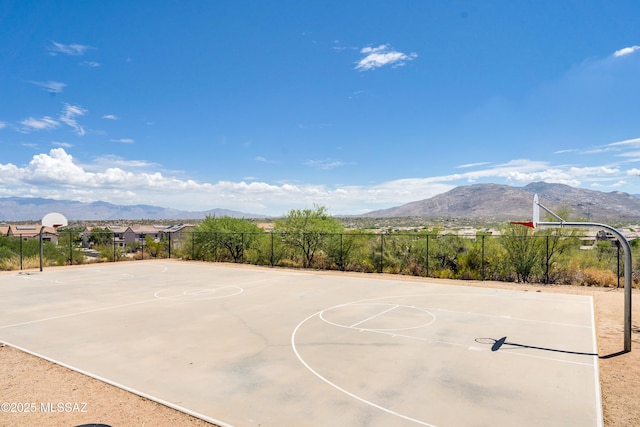 view of basketball court featuring a mountain view