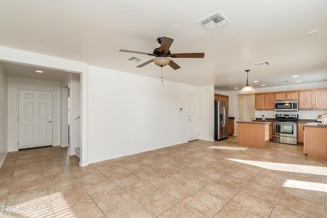 unfurnished living room with light tile patterned floors and ceiling fan