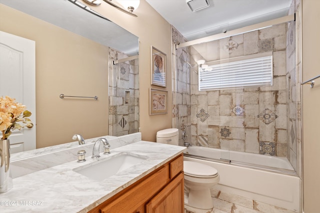 full bathroom featuring vanity, toilet, and enclosed tub / shower combo