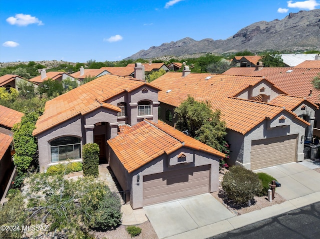 drone / aerial view featuring a mountain view