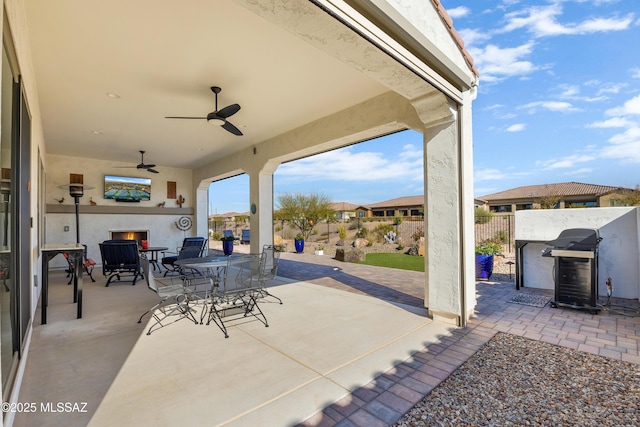 view of patio featuring a grill and ceiling fan