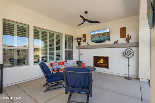 view of patio with exterior fireplace