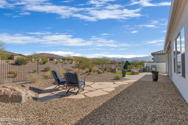 view of yard featuring a mountain view and a patio area