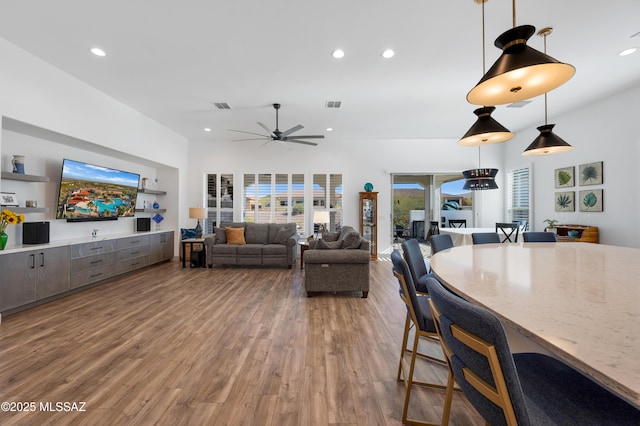 living room featuring hardwood / wood-style flooring and ceiling fan