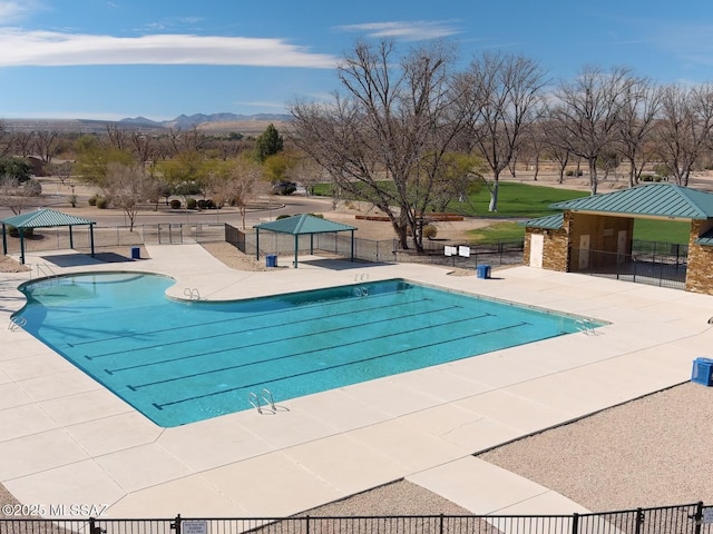 view of pool featuring a mountain view, a gazebo, and a patio