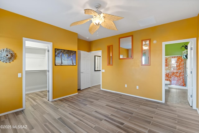 empty room featuring ceiling fan and light hardwood / wood-style flooring