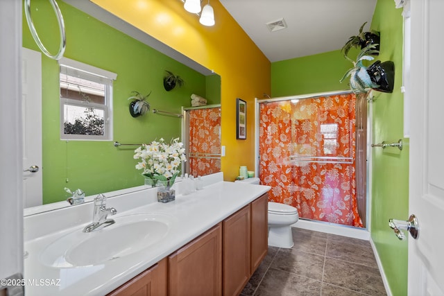 bathroom with walk in shower, vanity, and toilet