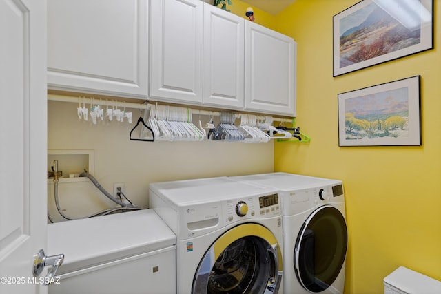 washroom with cabinets and independent washer and dryer