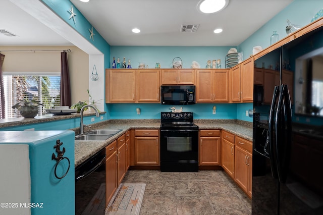 kitchen with sink and black appliances