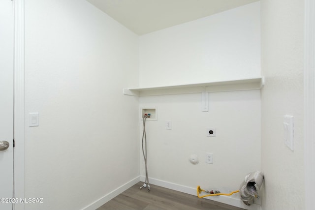 clothes washing area with washer hookup, hardwood / wood-style floors, hookup for a gas dryer, and electric dryer hookup