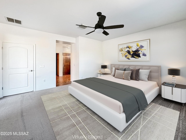 bedroom with ceiling fan and carpet