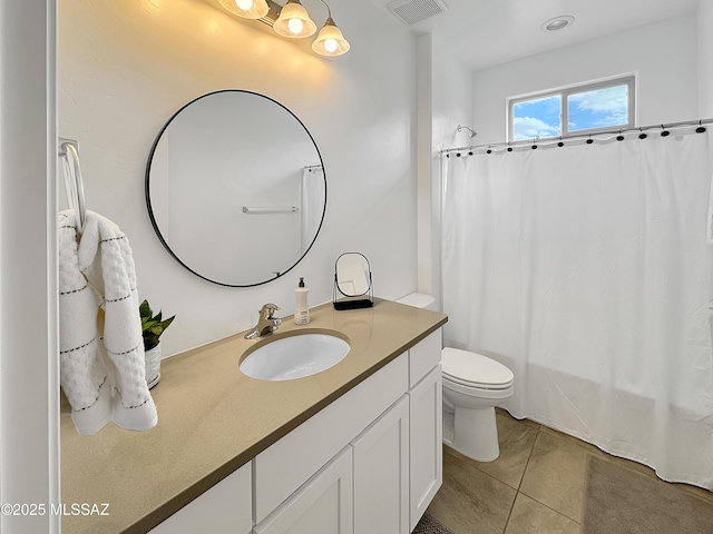 8015 S Galileo Ln, Tucson, AZ 85747 - full bath with tile patterned floors, visible vents, toilet, vanity, and shower / bath combo
