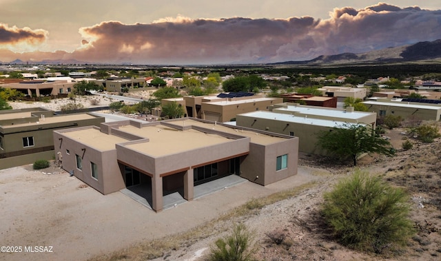 8015 S Galileo Ln, Tucson, AZ 85747 - aerial view at dusk with a mountain view