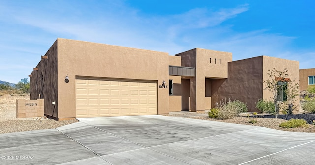 southwest-style home featuring a garage