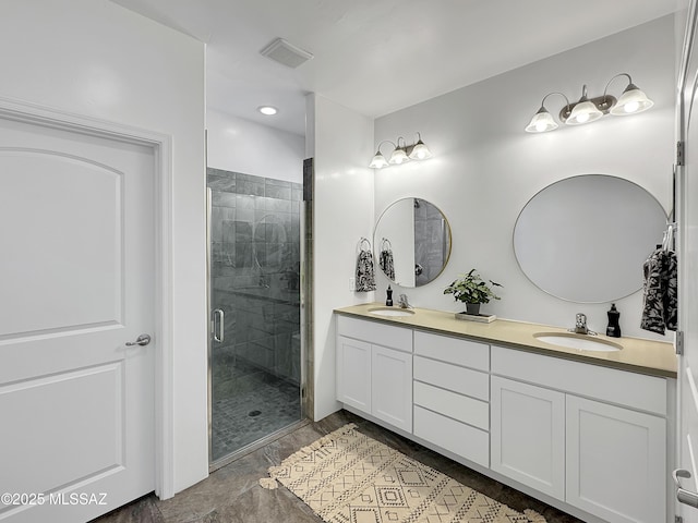 8015 S Galileo Ln, Tucson, AZ 85747 - full bathroom with visible vents, a sink, a shower stall, and double vanity