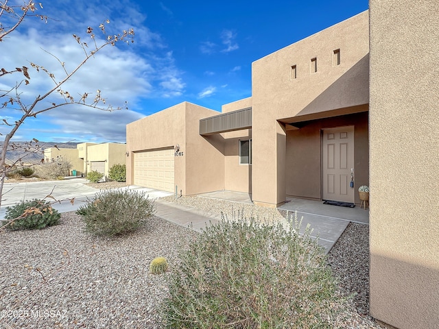 8015 S Galileo Ln, Tucson, AZ 85747 - exterior space featuring an attached garage and stucco siding