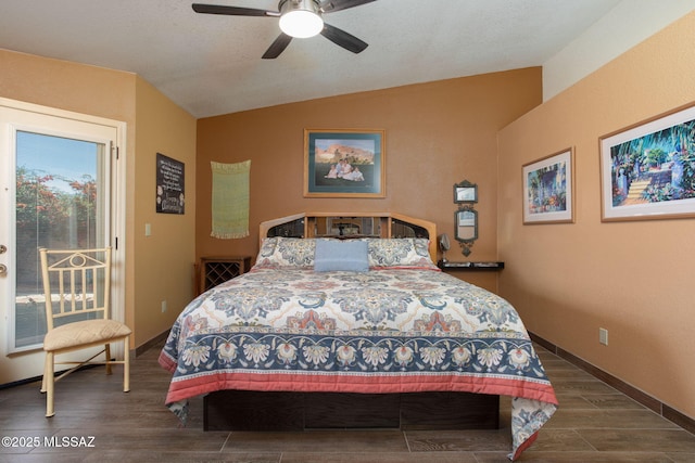 bedroom featuring access to outside, ceiling fan, dark hardwood / wood-style floors, and lofted ceiling