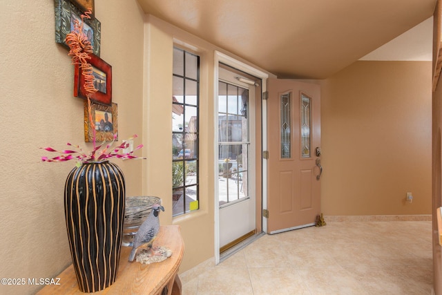 entryway featuring light tile patterned floors