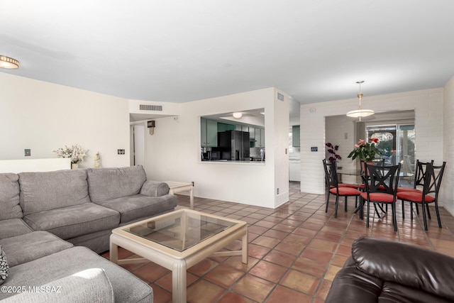 living room with dark tile patterned floors