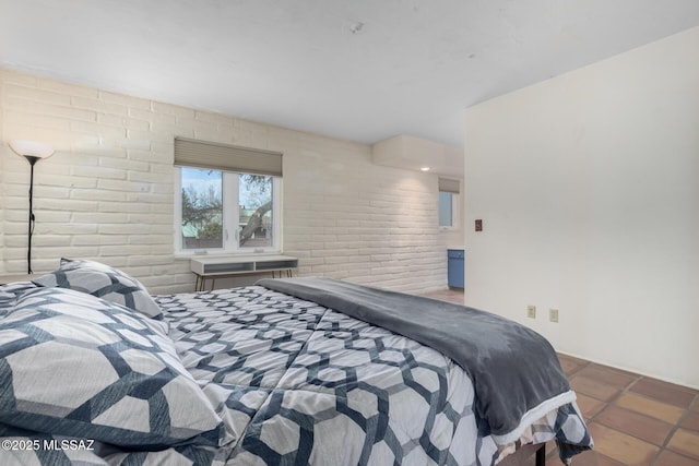 bedroom with brick wall