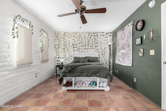 bedroom with ceiling fan and tile patterned flooring