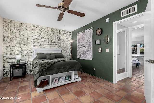 bedroom with tile patterned flooring and ceiling fan