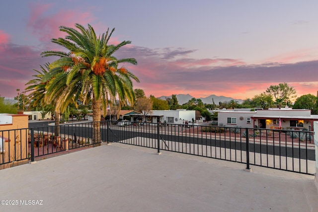 gate at dusk with a mountain view