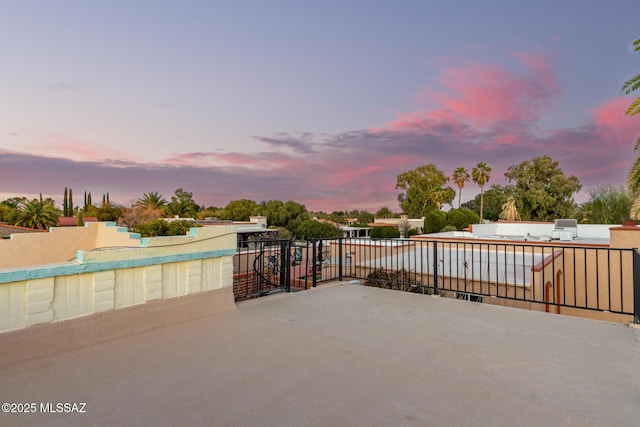 view of patio terrace at dusk