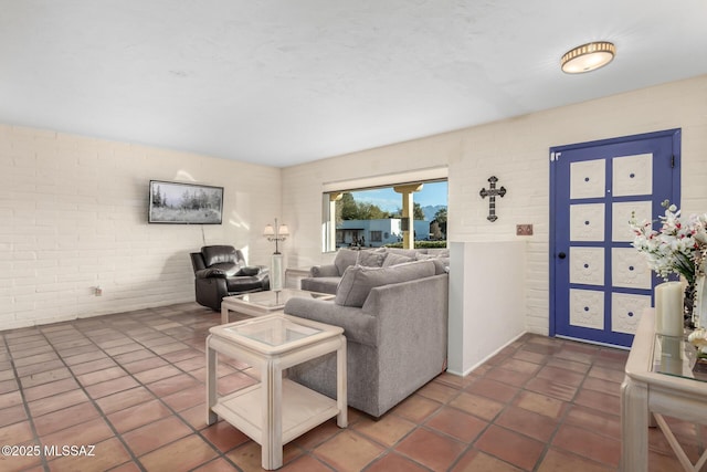 tiled living room with brick wall