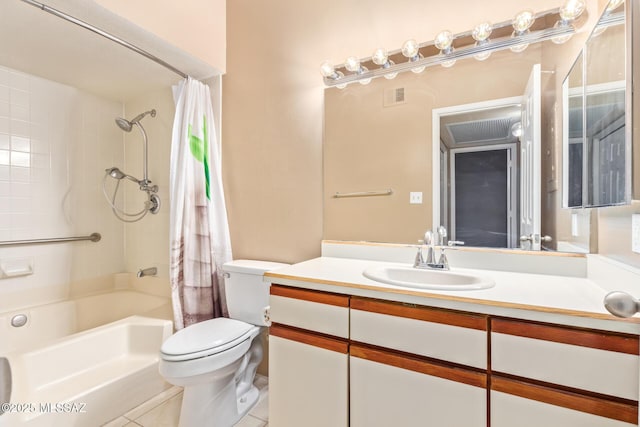 full bathroom with tile patterned floors, shower / bath combo with shower curtain, vanity, and toilet