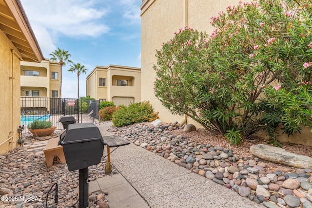 view of patio featuring a grill and a community pool