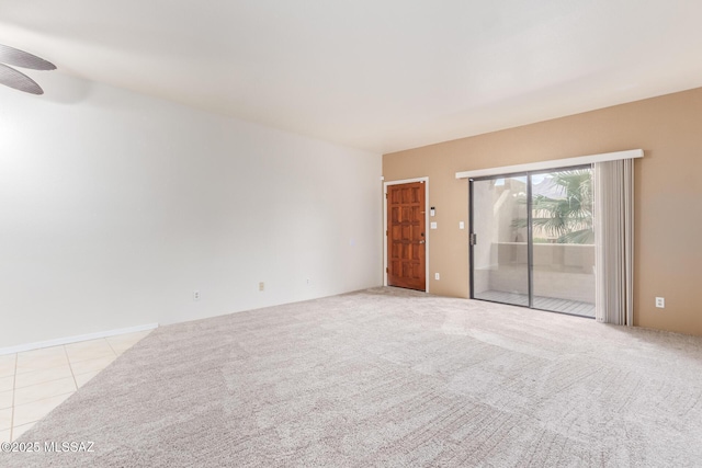 carpeted empty room featuring ceiling fan