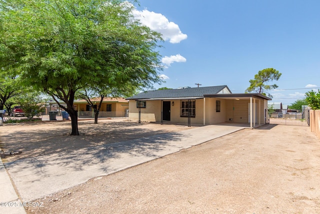 single story home with a carport