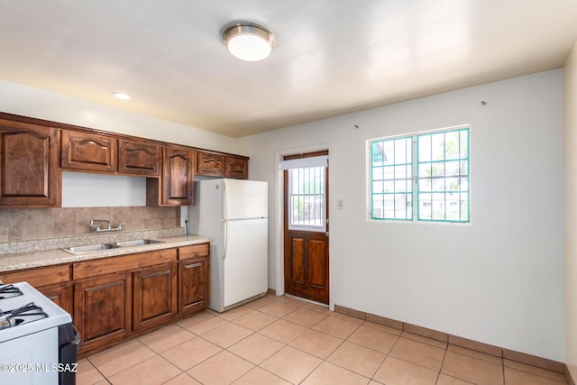 858 W Calle Evelina, Tucson, AZ 85706 - kitchen with backsplash, light tile patterned flooring, white appliances, and sink