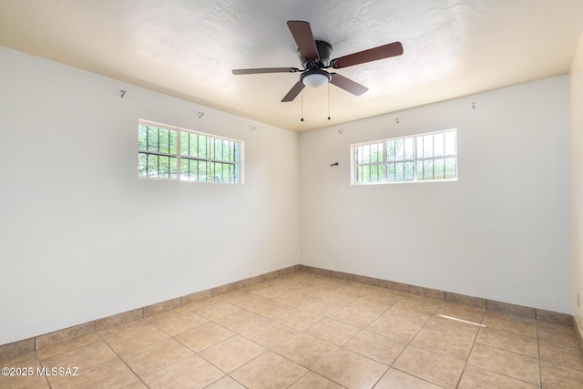 858 W Calle Evelina, Tucson, AZ 85706 - unfurnished room with ceiling fan and light tile patterned floors